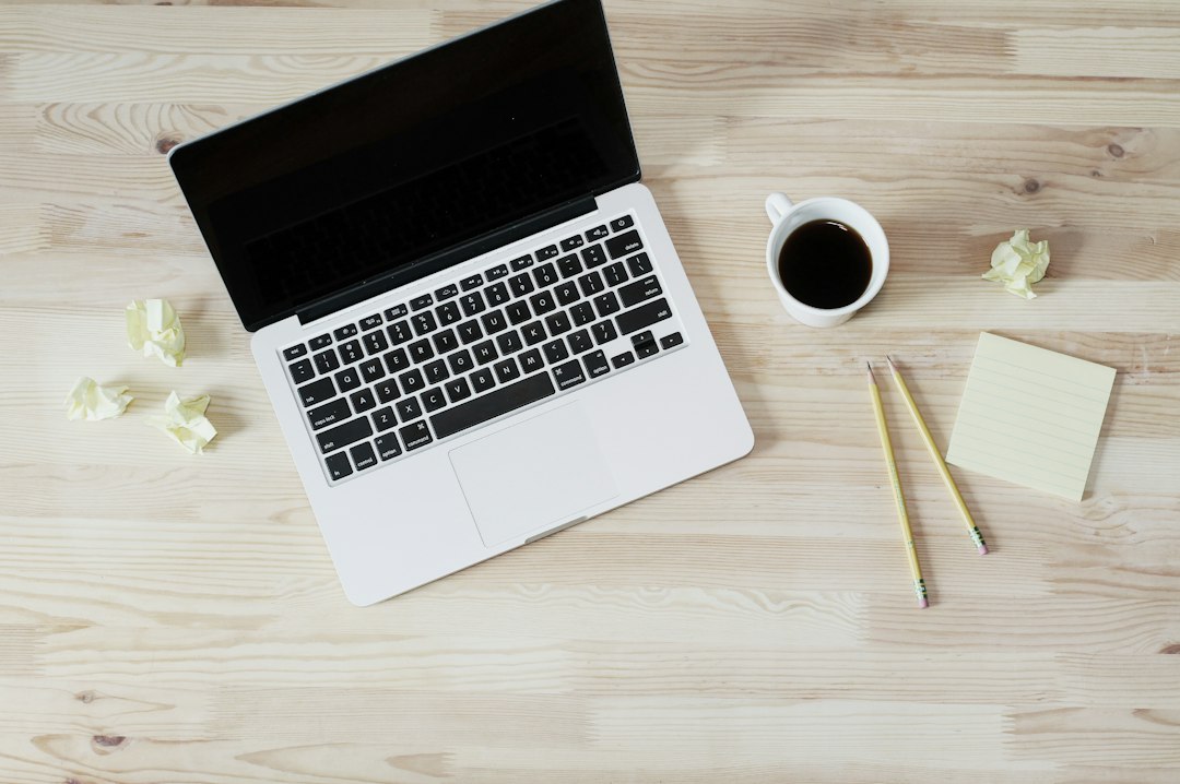 Coffee and notebook with customer retention calculations